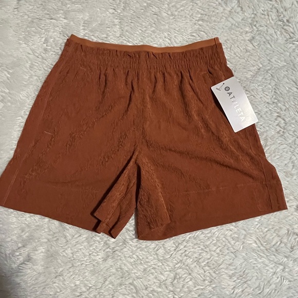 Athleta Pants - ATHLETA Rust-brown Pull On Zipped Pockets Stretchy Waist Eco Shorts
Size 4